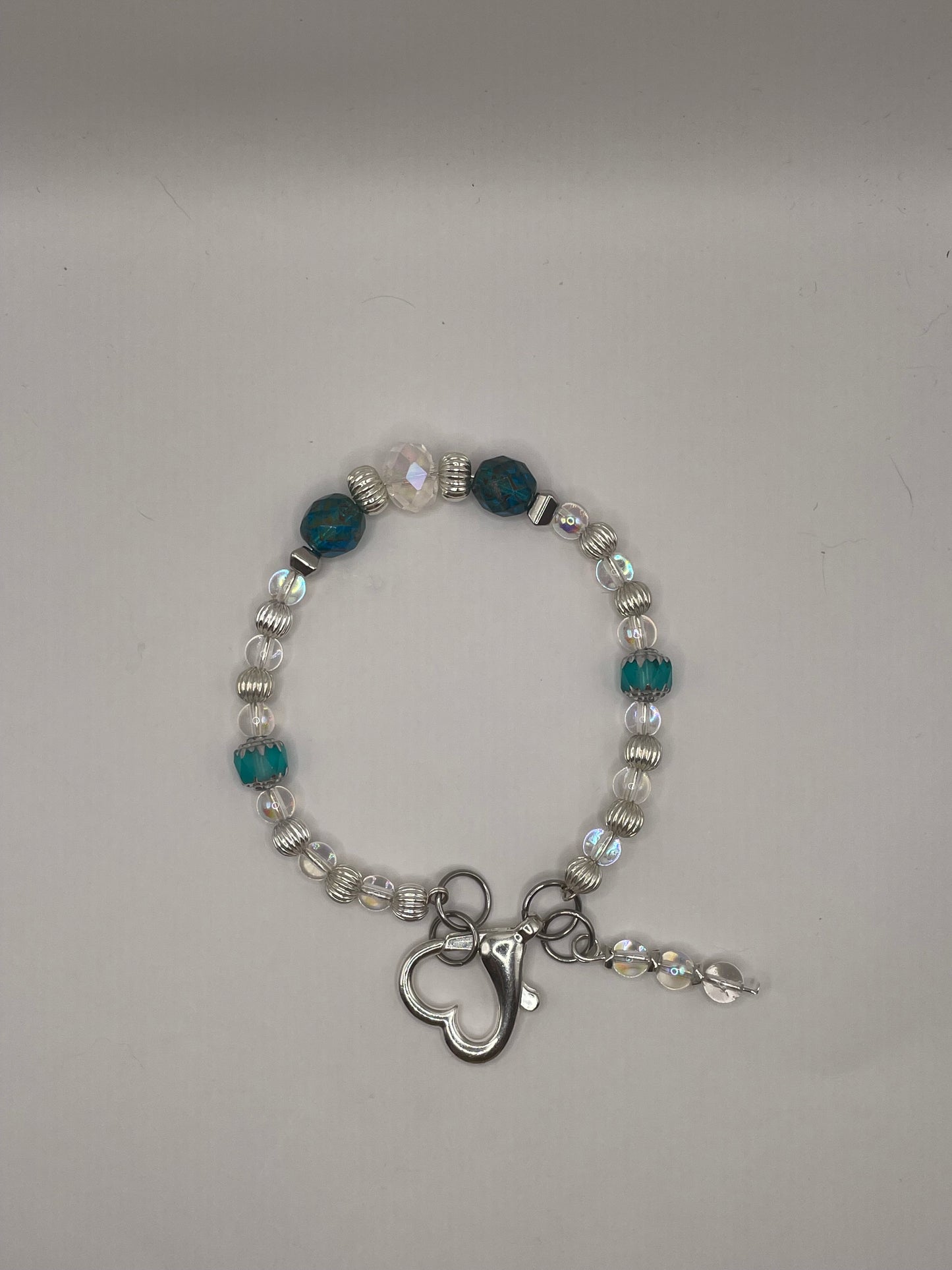 Tropical Waters Clear and Teal wire bracelet with heart clasp 8”