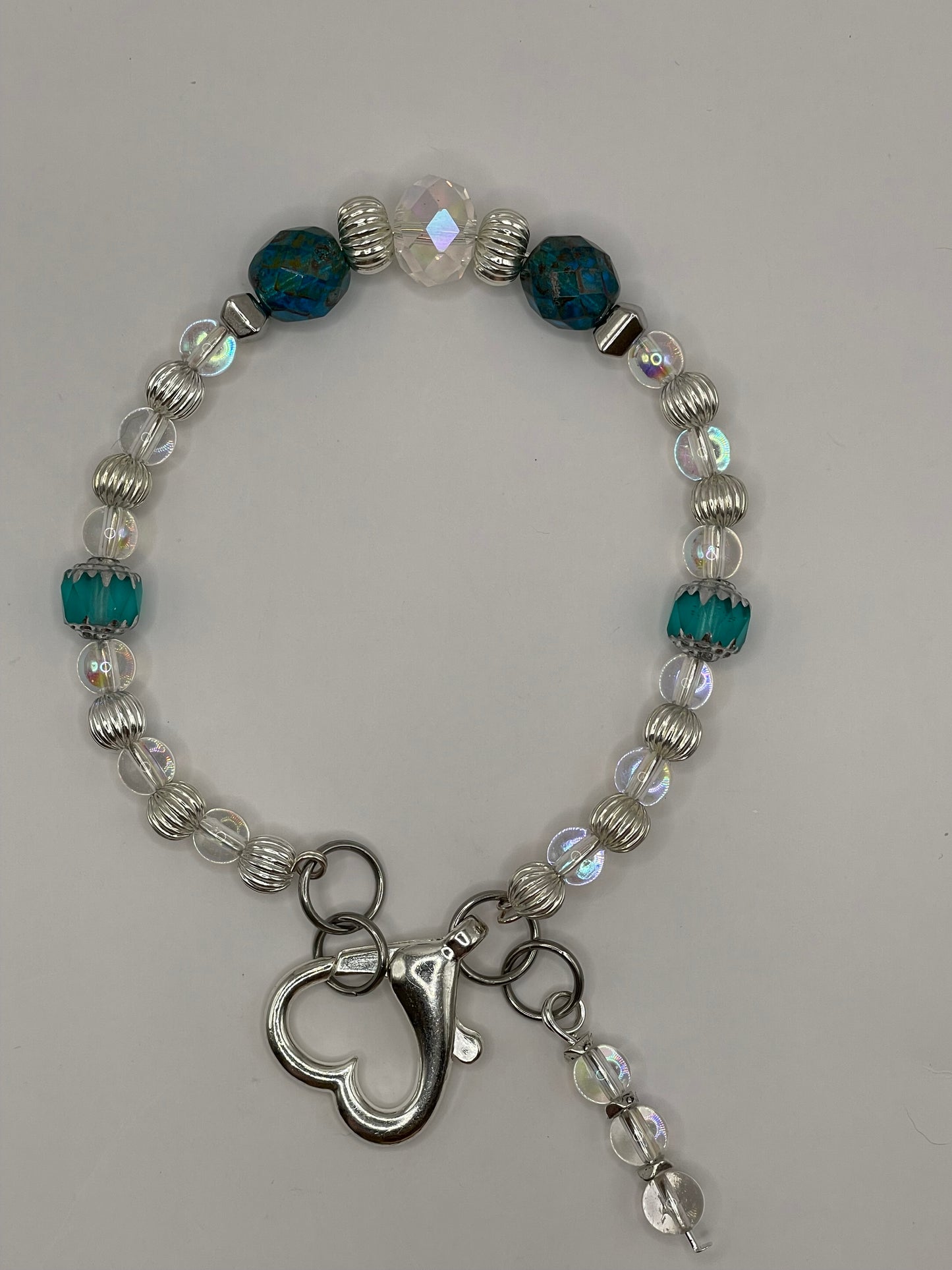 Tropical Waters Clear and Teal wire bracelet with heart clasp 8”