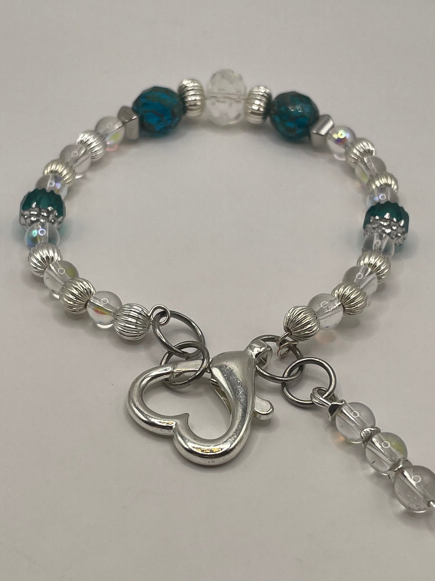 Tropical Waters Clear and Teal wire bracelet with heart clasp 8”